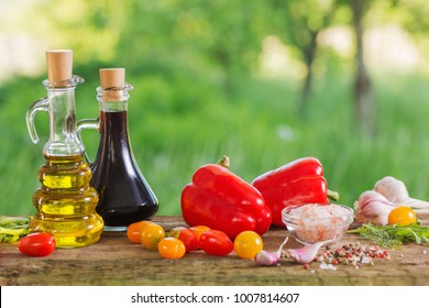 vegetables with oil on wooden table outdoor