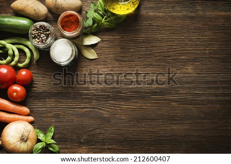 Vegetables on old wooden background overhead close up shoot