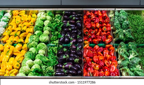 Vegetables on shelf in supermarket.  Peppers, broccoli and beans. - Powered by Shutterstock