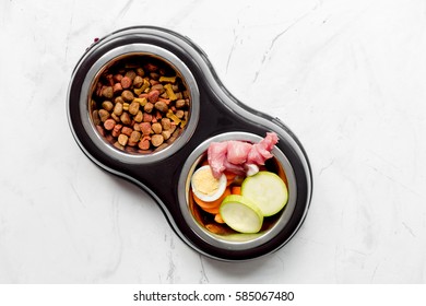 Vegetables and petfood on kitchen table background top view mock up