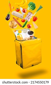 Vegetables, products that flying out of a open yellow courier food delivery bag, isolated on a yellow background. Fresh food delivery concept. - Shutterstock ID 2174550179