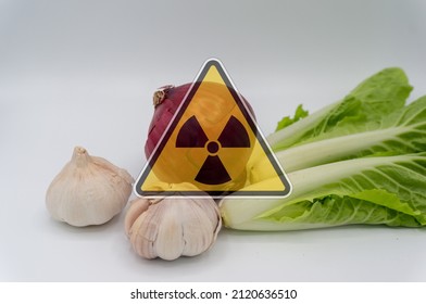vegetables with radiation warnings.contaminated foods.Radioactive soil.metaphor for nuclear threat.Nuclear leak,Environmental damage.white background.