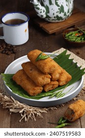 vegetables risoles or risol sayur or risoles sayur stuffed with veggies and enclosed in crepe-like wrappers and rolled into bread crumbs and fried. 
