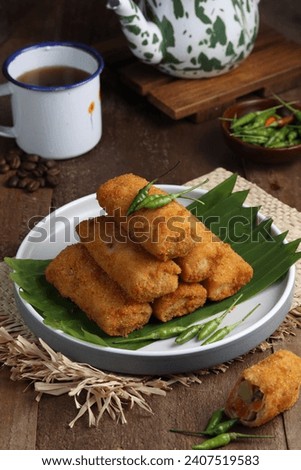 vegetables risoles or risol sayur or risoles sayur stuffed with veggies and enclosed in crepe-like wrappers and rolled into bread crumbs and fried. 

