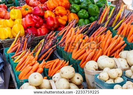 Vegetables for sale at a farmer's market. Fresh peppers, carrots and potatoes. ストックフォト © 
