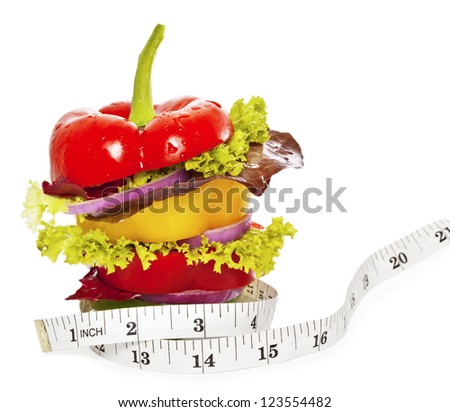 Vegetables sandwich with tape measure around it as a concept of healthy lifestyle or healthy eating recepe. Isolated on White. Closeup