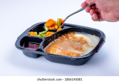 Vegetables Scooped Out Of A TV Dinner Tray