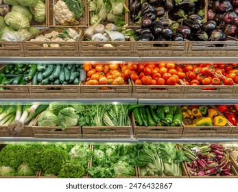 Vegetables of various kinds displayed in boxes on shelves in the greengrocer's shop, tomatoes and cabbage and colorful peppers and cabbage with eggplant and salads for sale - Powered by Shutterstock