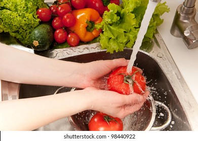 Vegetables washing, splashing water, fresh salad preparation - Powered by Shutterstock