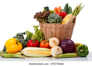vegetables in wicker basket isolate on white background - Shutterstock ID 295770458