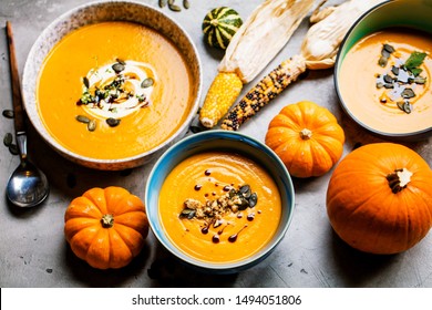 Vegetarian autumn pumpkin cream soup with seeds