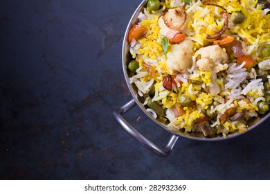 Vegetarian Biryani On Dark Metal Background With Copy Space