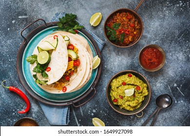 Vegetarian Breakfast Burrito And Ingredients. Homemade Tortillas Stacks With Veggie Mince, Vegetables, Guacamole And Avocado . Filling, Colorful And Delicious. Top View, Blank Space