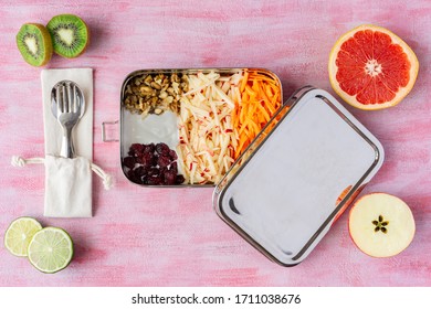 Vegetarian Carrot And Apple Salad In A Big Stainless Steel Food Container. Plastic Free Lunch Box And Metal Spoon And Fork. Some Fruits Around. Zero Waste, Eco Friendly. 