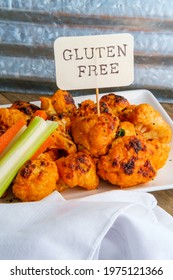 Vegetarian Cauliflower Buffalo Wings Served With Blue Cheese Dipping Sauce And Sliced Carrots And Celery