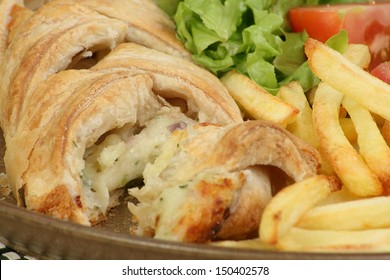 Vegetarian Cheese And Potato Pastry Plait With Fries And Salad