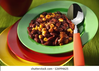 Vegetarian chili con carne on colorful plates