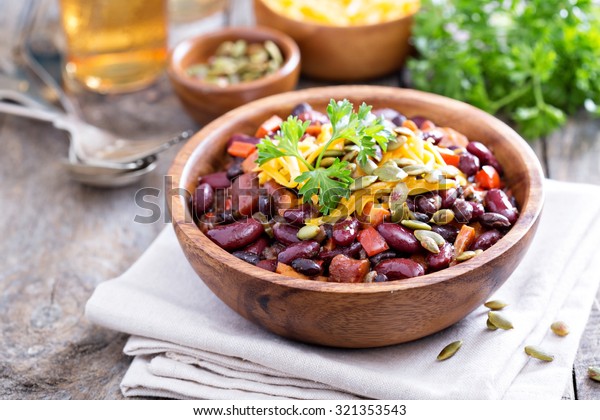 Vegetarian chili with red and black beans, cheddar\
and pumpkin seeds