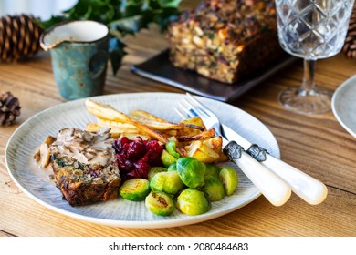 Vegetarian Christmas Dinner With Nut Roast, Mushroom Sauce, Roast Parsnips And Brussel Sprouts