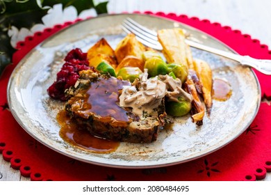 Vegetarian Christmas Dinner With Nut Roast, Mushroom Sauce, Roast Parsnips And Brussel Sprouts