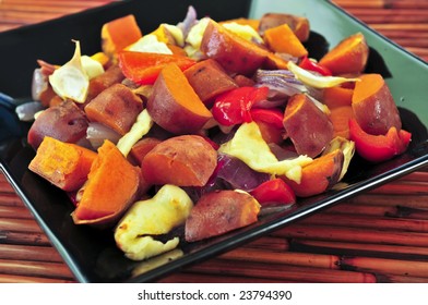 Vegetarian Dish Of Roasted Yams With Cheese And Peppers