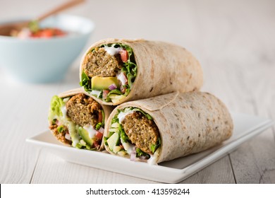 Vegetarian falafel wraps with avocado and cheese 