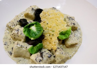 Vegetarian Gnocchi With Brussel Sprout Leaves, Wood Ear Mushrooms, Truffle Cream And Parmesan Crisp 