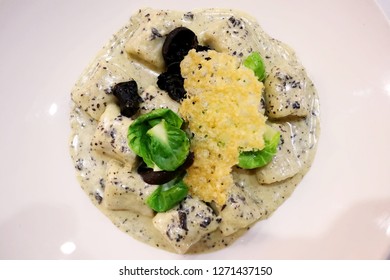 Vegetarian Gnocchi With Brussel Sprout Leaves, Wood Ear Mushrooms, Truffle Cream And Parmesan Crisp 