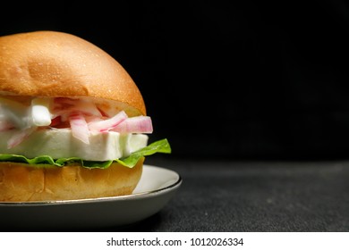 Vegetarian Greek Burger On Black Background