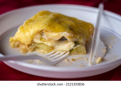 Vegetarian Lasagne with cheese and spinach in disposable plate - Shutterstock ID 2121333836