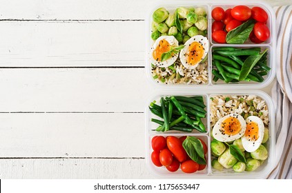 Vegetarian Meal Prep Containers With Eggs, Brussel Sprouts, Green Beans And Tomato. Dinner In Lunch Box. Top View. Flat Lay