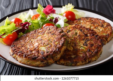 Vegetarian menu: mushroom vegetable patty with fresh salad on a plate close-up on the table. horizontal
 - Powered by Shutterstock