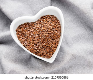 Vegetarian Organic Nutrition Flax Seeds In Bowl On Textile Background