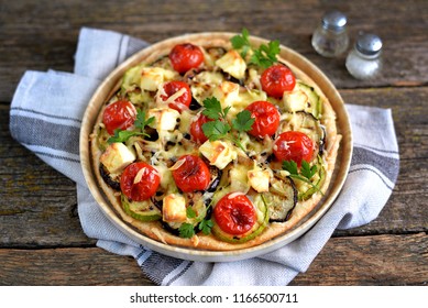 Vegetarian Pie With Zucchini And Grilled Eggplant, Cherry Tomatoes, Hard Cheese And Cream Cheese.