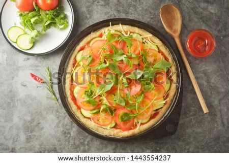 Vegetarian pizza. Cooking process of vegetable homemade pizza with fresh ingredients isolated on dark background. Copy space. Step by step.