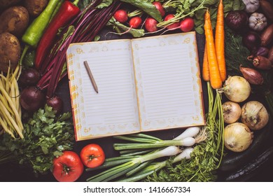 Vegetarian Raw Food Recipe. Blank Empty Cook Book Mockup With Fresh Vegetables. Healthy Eating Concept With Copy Space.