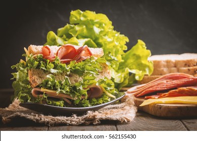 Vegetarian Sandwiches With Cream Cheese And Vegetables On Black Background, Top View