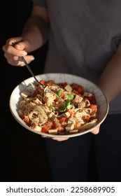 Vegetarian spaghetti with tomatoes, tofu and basil - Shutterstock ID 2258689905