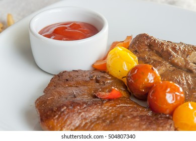 Vegetarian Steak Made From Vegan Meat Seitan, With Cherry Tomatoes 