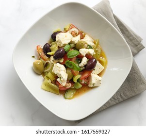 Vegetarian Tomato, Cucumber, Pepper, Olives, Basil, Sheep Cheese Salad. Classic and healthy Dish. - Shutterstock ID 1617559327