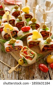 Vegetarian Tortilla Pinwheels Served On A Board Close Up View