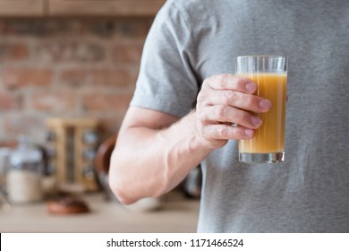 Vegetarian Or Vegan Dieting. Natural Delicious Organic Fruit Juice. Unrecognizable Man Holding A Glass With A Drink.