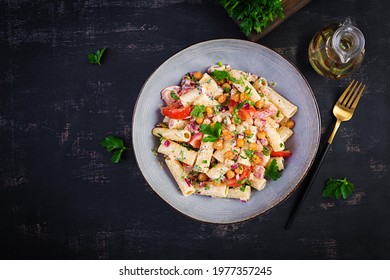 Vegetarian Vegetable Pasta. Pasta Rigatoni With Tomato, Red Onion, Parsley And Fried Chickpeas With Nut Sauce. Vegan Food. Top View, Overhead