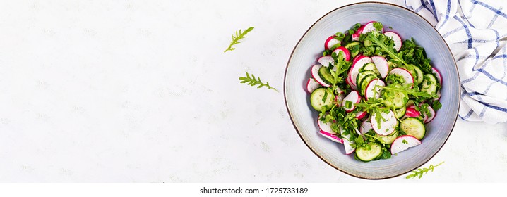 Vegetarian Vegetable Salad Of Radish, Cucumbers, Arugula And Green Onions. Healthy  Vegan Food. Top View, Overhead, Banner