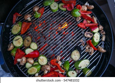 Veggie BBQ. Raw Vegetables On Coal Weber Grill.