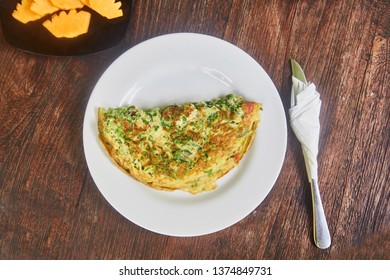 Veggie Breakfast In Bali. Omelet And A Plate Of Fruit (watermelon And Mango). Traditional Breakfast In Indonesia. Dishes On A Wooden Table