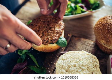 Veggie Burger Being Made On A Wooden Table