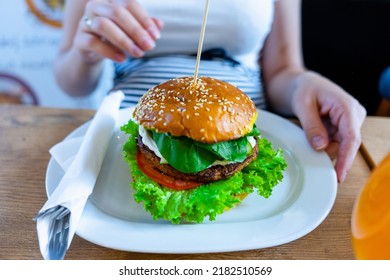 Veggie Burger Healthy Vegan Food. Salad, Avocado, Vegetable On Vegetarian Hamburger Eating Cute Woman. Vegan Sandwich Healthy Diet Food