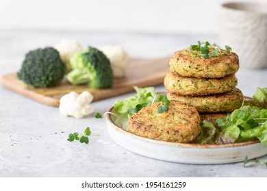 veggie burgers with quinoa, broccoli, cauliflower served with salad. plant based food. space for text