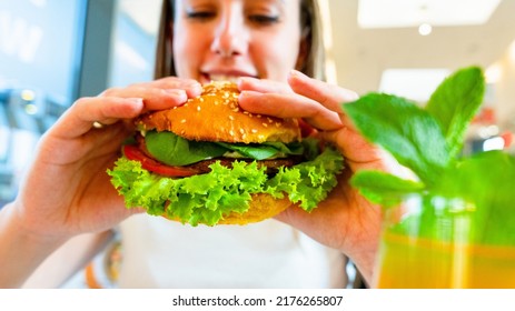 Veggie Sandwich Healthy Vegan Burger. Cute Cheerful Girl Eating Vegetarian Hamburger With Salad, Avocado, Vegetable. Hamburger Vegan Healthy Diet Food